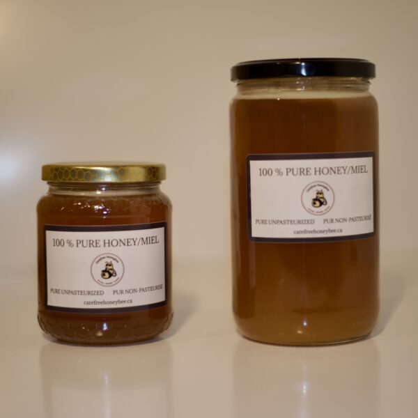 Two jars of pure unpasteurized honey